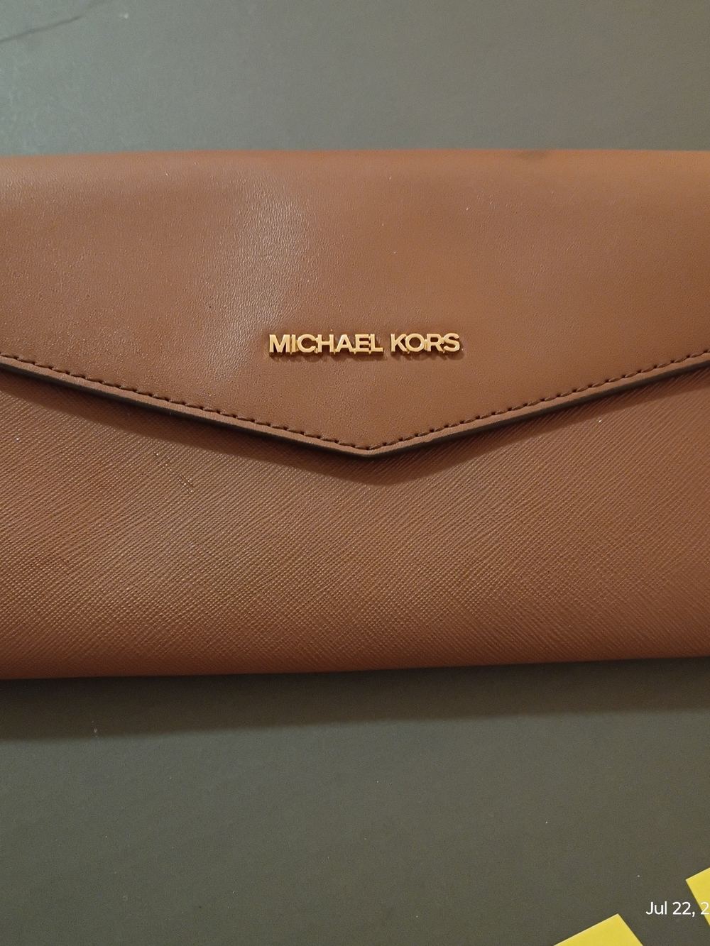 Michael Kors tan leather envelope clutch with gold logo